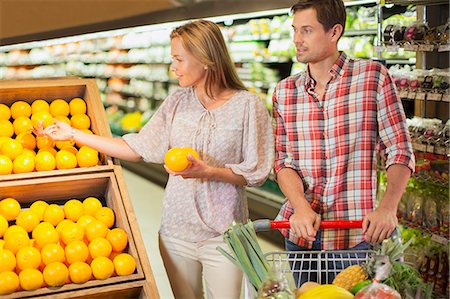 produce grocery store - Couple shopping together in grocery store Stock Photo - Premium Royalty-Free, Code: 6113-07790929