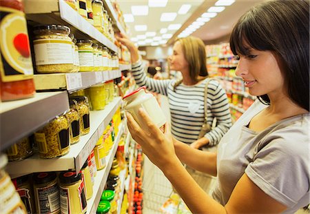 food aisle - Women shopping in grocery store Stock Photo - Premium Royalty-Free, Code: 6113-07791179