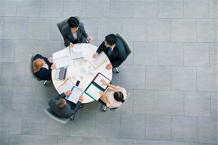 Business people having meeting at table Stock Photo - Premium Royalty-Free, Code: 6113-07791240