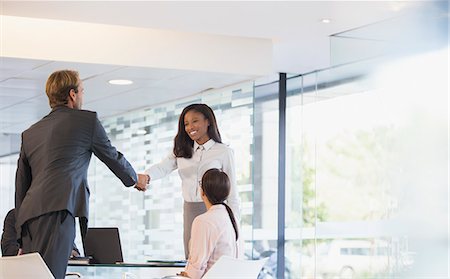 simsearch:6113-06497907,k - Business people shaking hands in office building Stock Photo - Premium Royalty-Free, Code: 6113-07791278