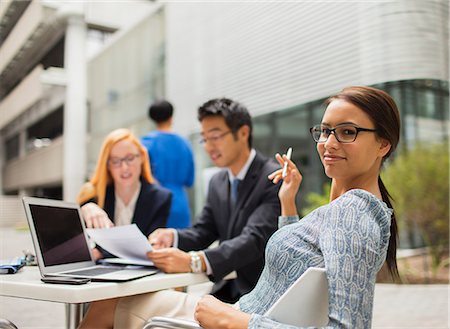 simsearch:6113-07791483,k - Business people talking at table outside office building Stock Photo - Premium Royalty-Free, Code: 6113-07791391