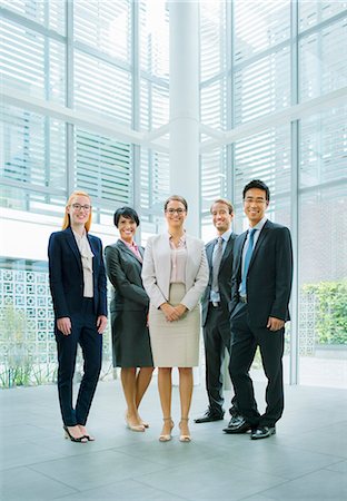 simsearch:6113-07791483,k - Business people gathered in office building Stock Photo - Premium Royalty-Free, Code: 6113-07791442