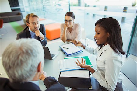Business people talking at table in office building Stock Photo - Premium Royalty-Free, Code: 6113-07791469