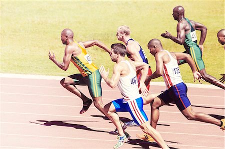 running track competition - Sprinters racing on track Stock Photo - Premium Royalty-Free, Code: 6113-07730460