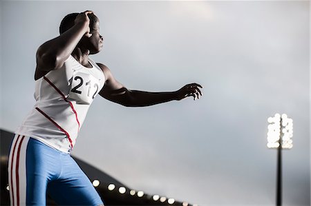 simsearch:6113-07730460,k - Track and field athlete throwing shot put Stock Photo - Premium Royalty-Free, Code: 6113-07730470