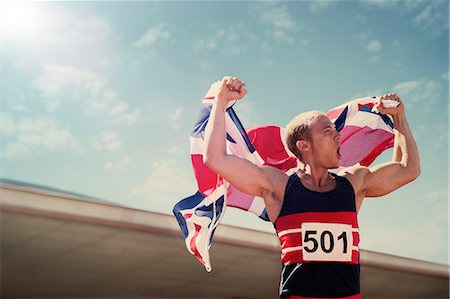 simsearch:6113-07730460,k - Track and field athlete holding British flag Stock Photo - Premium Royalty-Free, Code: 6113-07730479