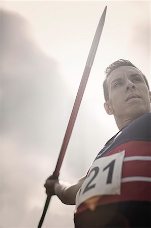 Track and field athlete holding javelin Stock Photo - Premium Royalty-Free, Code: 6113-07730483