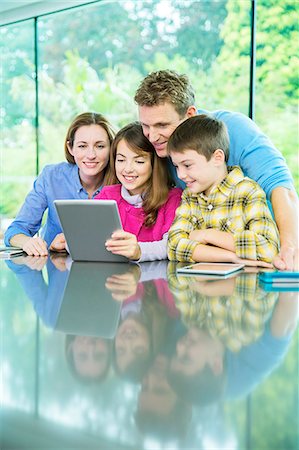 simsearch:6113-07730567,k - Family using digital tablet together Stock Photo - Premium Royalty-Free, Code: 6113-07730523