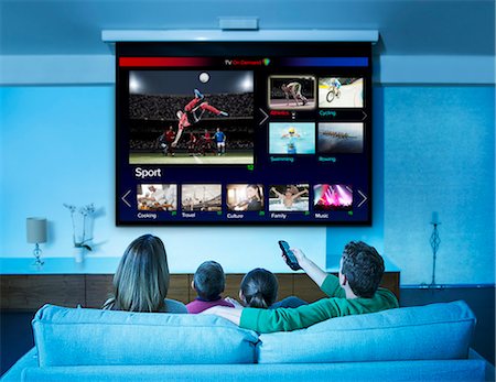 simsearch:649-07239830,k - Family watching television in living room Stock Photo - Premium Royalty-Free, Code: 6113-07730533