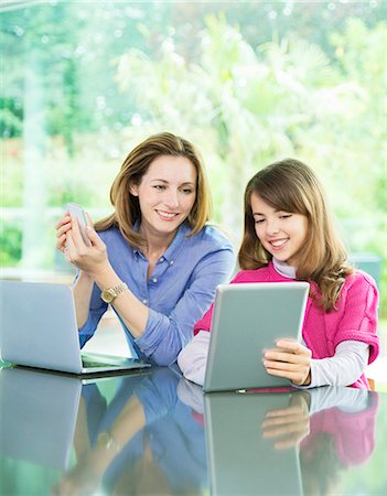 simsearch:6113-07730780,k - Mother and daughter using technology Stock Photo - Premium Royalty-Free, Code: 6113-07730537