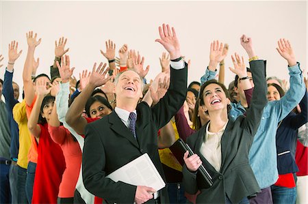 Business people waving Stock Photo - Premium Royalty-Free, Code: 6113-07730664