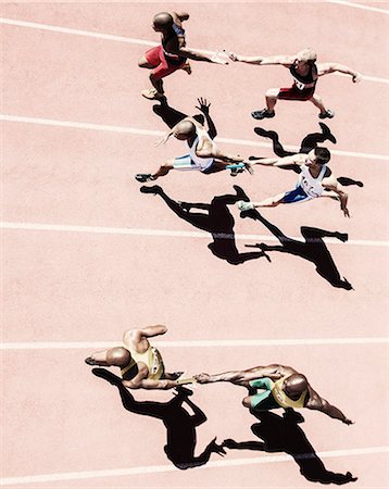 steps high angle - Relay runners handing off batons on track Stock Photo - Premium Royalty-Free, Code: 6113-07730604