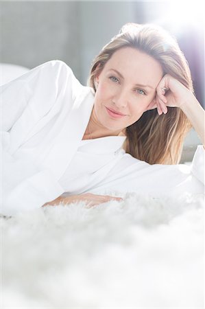 pampered women - Woman in bathrobe laying on bed Stock Photo - Premium Royalty-Free, Code: 6113-07730791