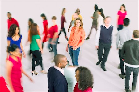 standing concept individuality concept - Portrait of businesswoman standing out from the crowd Photographie de stock - Premium Libres de Droits, Code: 6113-07730723