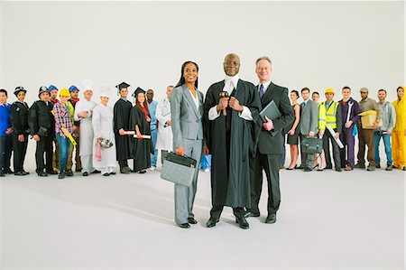 Workforce behind confident judge and lawyers Stock Photo - Premium Royalty-Free, Code: 6113-07730738