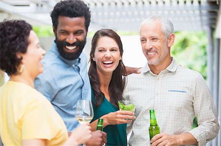 simsearch:6113-07731034,k - Friends laughing at party Stock Photo - Premium Royalty-Free, Code: 6113-07730869