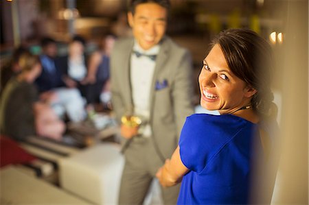 simsearch:6113-07731034,k - Woman laughing at party Stock Photo - Premium Royalty-Free, Code: 6113-07730892