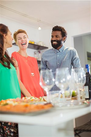 dinner (day) - Friends laughing at party Stock Photo - Premium Royalty-Free, Code: 6113-07730895