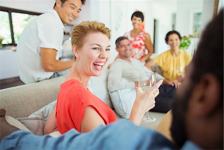 simsearch:6113-07731034,k - Friends laughing together at party Stock Photo - Premium Royalty-Free, Code: 6113-07730824