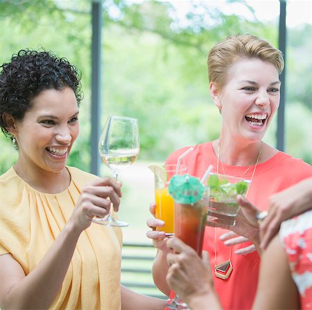 simsearch:6113-06909171,k - Women toasting each other at party Stock Photo - Premium Royalty-Free, Code: 6113-07730829
