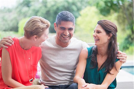 Friends relaxing together outdoors Stock Photo - Premium Royalty-Free, Code: 6113-07730969