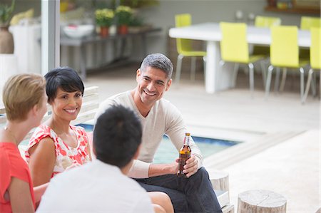 simsearch:6113-07731034,k - Friends talking at party Stock Photo - Premium Royalty-Free, Code: 6113-07730987
