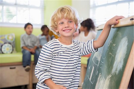 simsearch:6113-07731249,k - Student drawing on chalkboard in classroom Stock Photo - Premium Royalty-Free, Code: 6113-07731174