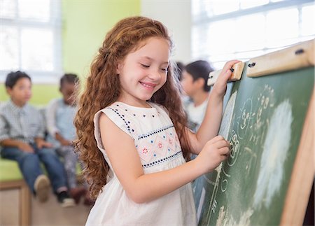 preschool - Student drawing on chalkboard in classroom Stock Photo - Premium Royalty-Free, Code: 6113-07731179