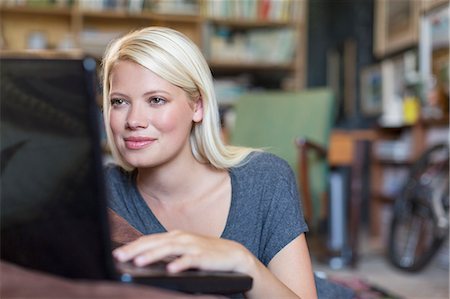 simsearch:6113-07730780,k - Woman using laptop in study Stock Photo - Premium Royalty-Free, Code: 6113-07731107