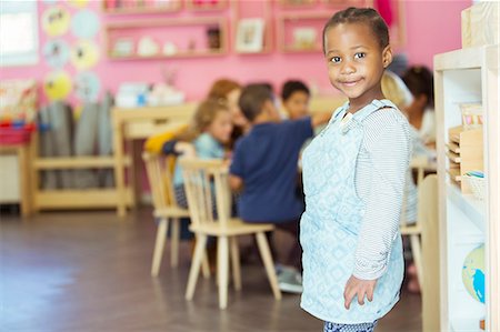 preschool girl - Student smiling in classroom Stock Photo - Premium Royalty-Free, Code: 6113-07731256