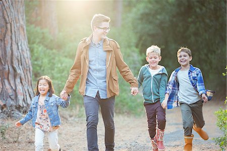 people walking in a line - Students and teacher walking in forest Stock Photo - Premium Royalty-Free, Code: 6113-07731291