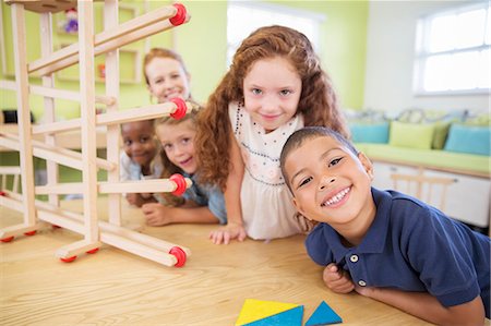 simsearch:6113-07731249,k - Students and teacher smiling in classroom Stock Photo - Premium Royalty-Free, Code: 6113-07731202