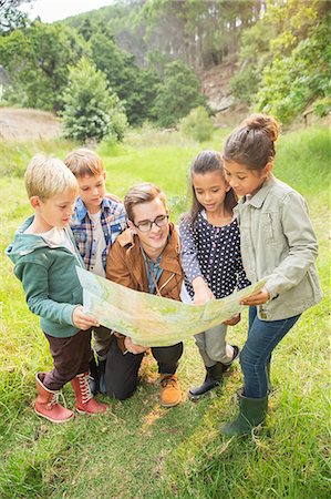 simsearch:633-05401710,k - Students and teacher reading map in field Stock Photo - Premium Royalty-Free, Code: 6113-07731212