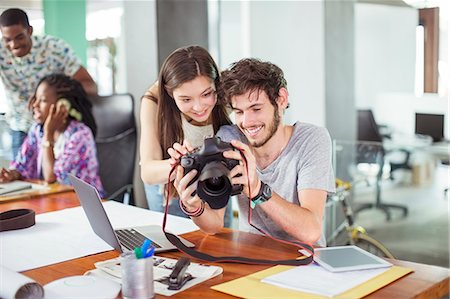 share tablet office - People reviewing photos together in office Stock Photo - Premium Royalty-Free, Code: 6113-07731362