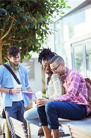 skype - Friends talking at sidewalk cafe Stock Photo - Premium Royalty-Free, Code: 6113-07731434