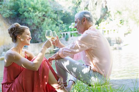 simsearch:6113-07790495,k - Couple toasting each other outdoors Stock Photo - Premium Royalty-Free, Code: 6113-07731518