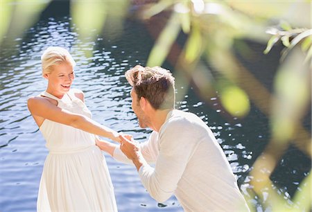 reflecting pool - Couple playing by pool Stock Photo - Premium Royalty-Free, Code: 6113-07731622