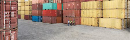 storage compartment - Workers walking near cargo containers Stock Photo - Premium Royalty-Free, Code: 6113-07808345