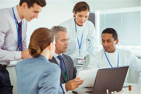 Scientists and business people talking in conference room Stock Photo - Premium Royalty-Free, Code: 6113-07808471