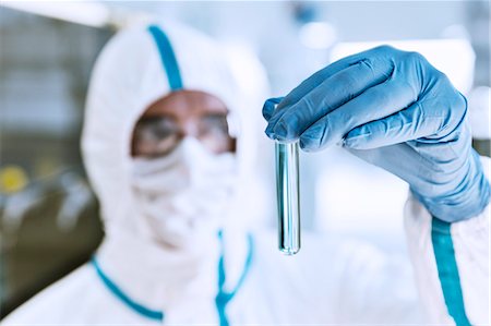 simsearch:6113-07589192,k - Close up of scientist in clean suit examining sample in test tube Stock Photo - Premium Royalty-Free, Code: 6113-07808498