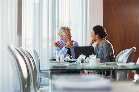 simsearch:6108-06907153,k - Business people discussing in restaurant Stock Photo - Premium Royalty-Free, Code: 6113-07808630