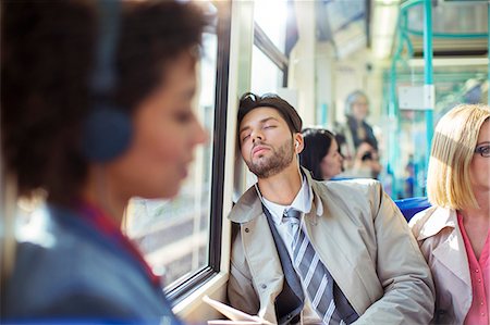 passenger train not subway not training - Businessman napping on train Stock Photo - Premium Royalty-Free, Code: 6113-07961655