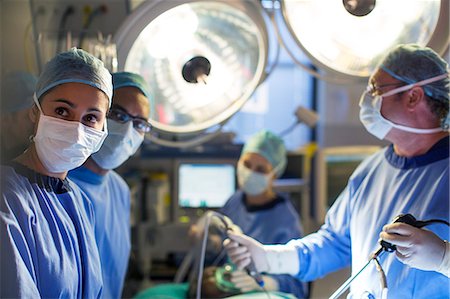 surgeon - Team of surgeons during operation in operating theater Stock Photo - Premium Royalty-Free, Code: 6113-07905887