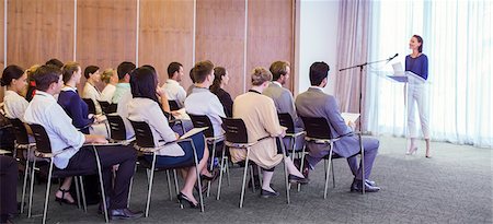 riunione - Young woman delivering speech before audience in conference room Fotografie stock - Premium Royalty-Free, Codice: 6113-07906090