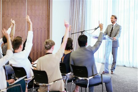 People at seminar raising hands to ask questions Stock Photo - Premium Royalty-Free, Code: 6113-07906131