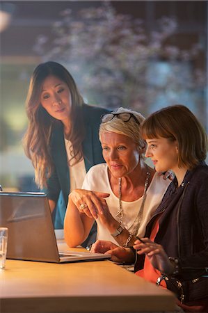 simsearch:6113-07906249,k - Businesswomen working together in office meeting Stock Photo - Premium Royalty-Free, Code: 6113-07906233