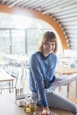 red haired businesswomen - Businesswoman smiling in cafeteria Stock Photo - Premium Royalty-Free, Code: 6113-07906308