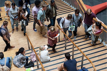 Elevated view of university students walking up and down stairs Stock Photo - Premium Royalty-Free, Code: 6113-07906509