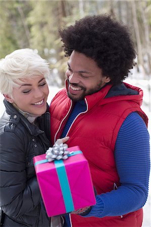 simsearch:649-06716867,k - Couple with Christmas gift Stock Photo - Premium Royalty-Free, Code: 6113-07906653