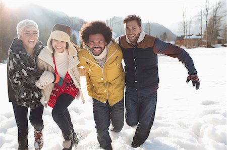 simsearch:6113-07147024,k - Friends running in snow Stock Photo - Premium Royalty-Free, Code: 6113-07906619